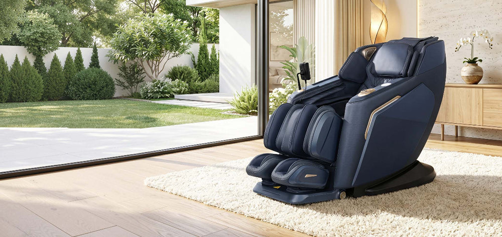Daiwa Rumba massage chair in navy blue upholstery placed in a modern living room beside floor-to-ceiling glass doors overlooking a garden. From Wish Rock Relaxation.