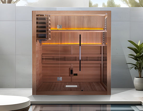 Golden Designs "Kuusamo Edition" 6 Person Indoor Traditional Sauna in Canadian red cedar placed in a modern poolside room with sleek tile walls from Wish Rock Relaxation