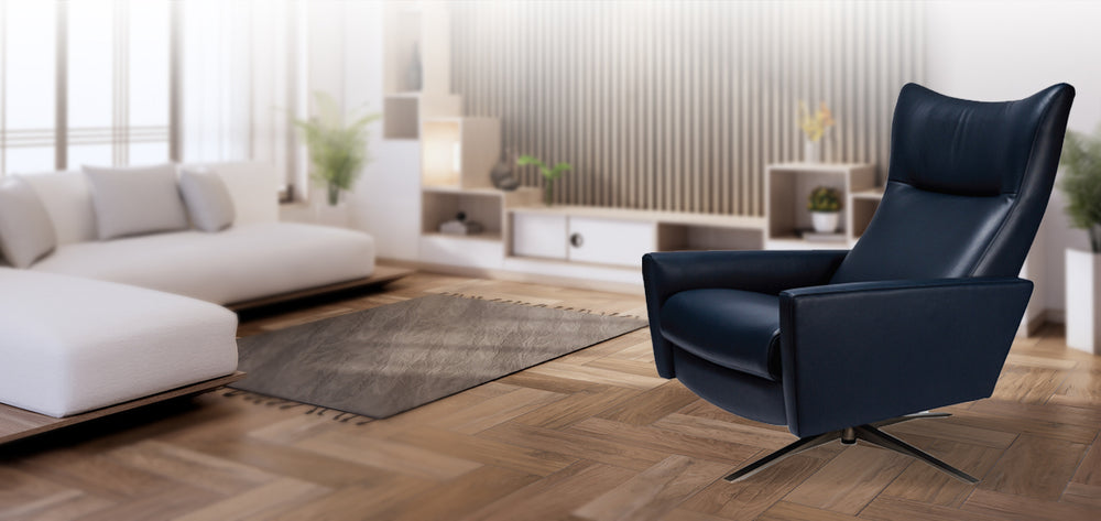 American Leather Comfort Air Stratus Echo Recliner in navy leather, featured in a minimalist modern living room with wood floors and white sectional sofa from Wish Rock Relaxation