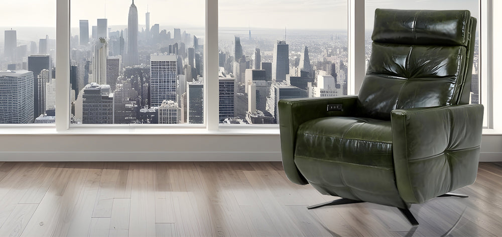 American Leather Comfort Air Rainier Solace Power Zero Gravity Recliner in deep green leather, positioned in front of panoramic city skyline windows with modern wood flooring from Wish Rock Relaxation