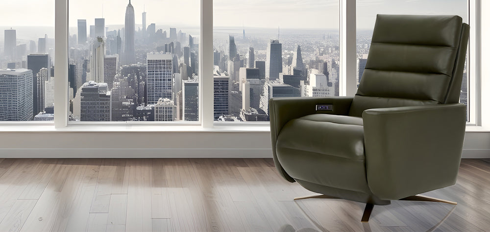 American Leather Comfort Air Cirrus Solace Power Zero Gravity Recliner in olive green leather, displayed in front of a panoramic city skyline with light hardwood flooring from Wish Rock Relaxation