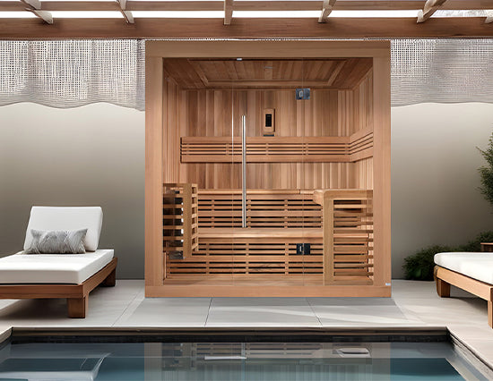 Golden Designs "Osla Edition" 6 Person Traditional Sauna - Canadian Red Cedar placed beside a luxury pool in natural wood from Wish Rock Relaxation