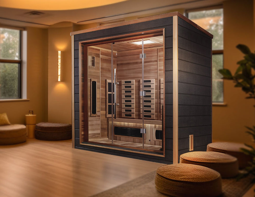 Golden Designs "Visby" 3 Person Hybrid Outdoor Sauna in Canadian red cedar placed in a cozy spa room, from Wish Rock Relaxation
