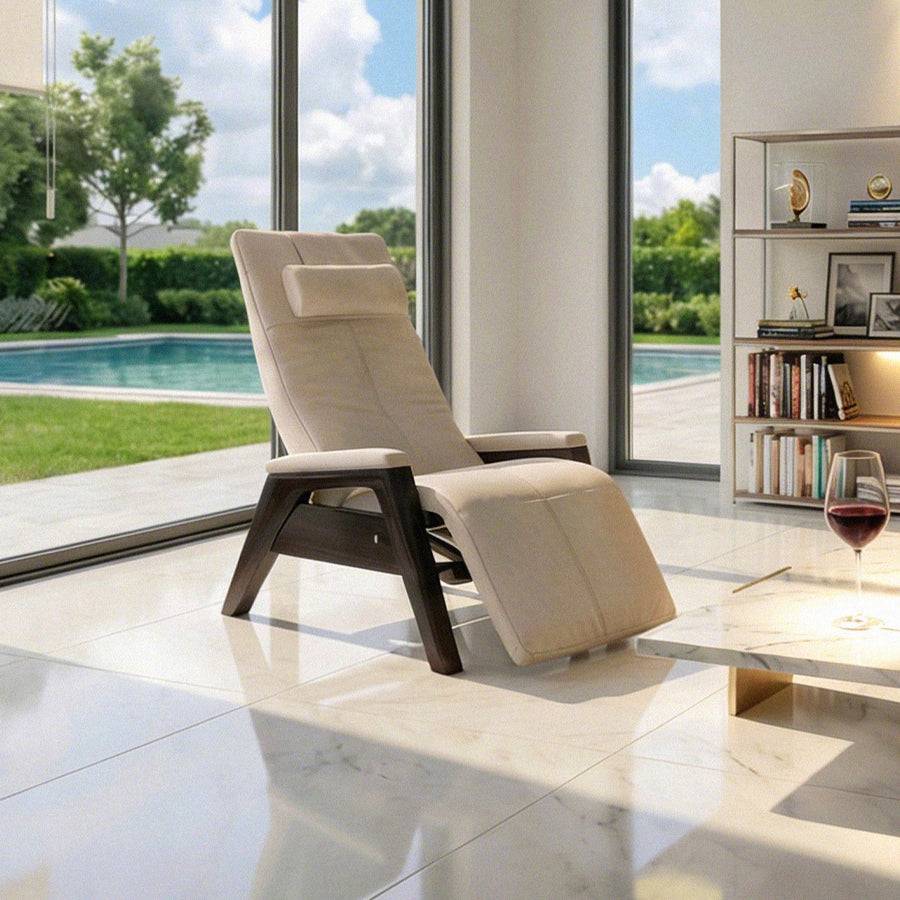 Human Touch Perfect Chair PC-610 Zero Gravity Chair in beige beside poolside window in modern living room from Wish Rock Relaxation