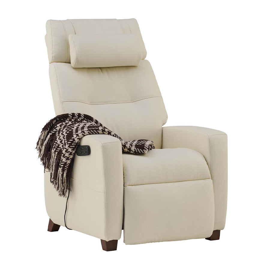 Human Touch Vesta Zero Gravity chair in cream with decorative throw blanket over armrest from Wish Rock Relaxation.