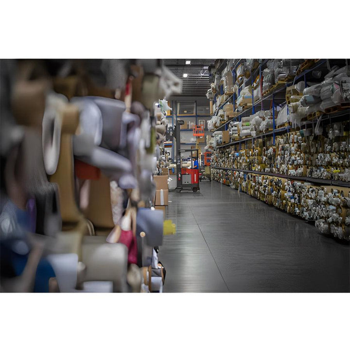 American Leather Comfort Air Atlas Echo Recliner upholstery materials stored in organized warehouse aisle.