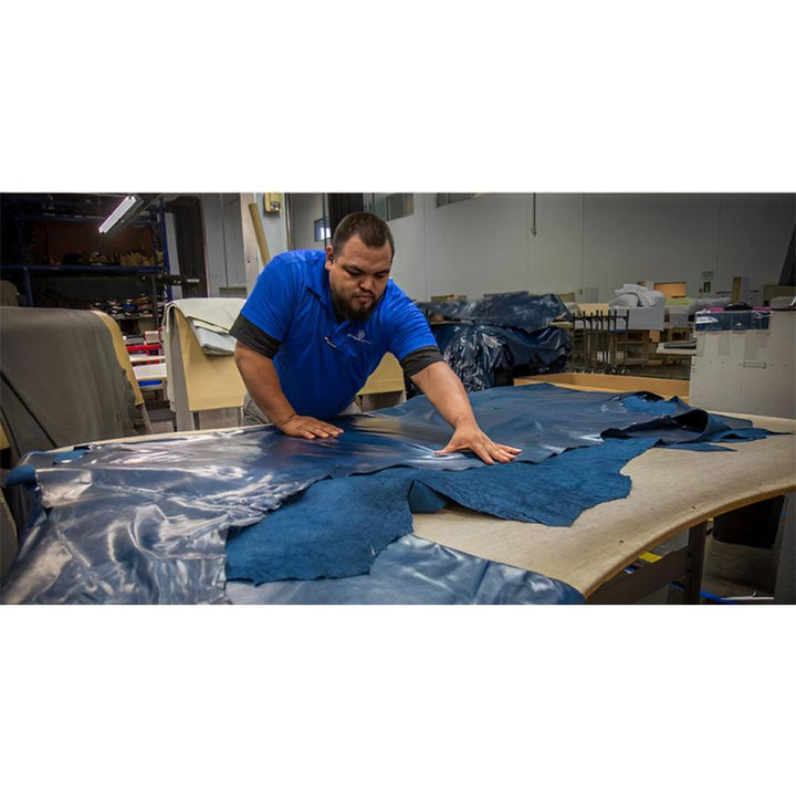 American Leather Ontario Comfort Air Zero Gravity Recliner leather being hand-inspected in workshop.