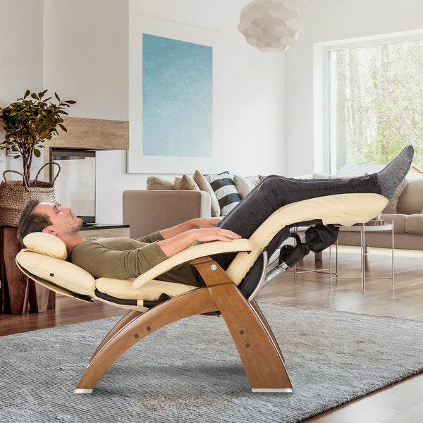 Human Touch Perfect Chair PC-610 Omni-Motion Classic Zero Gravity Chair in Walnut / Ivory Premium Leather Supreme Upholstery lifestyle image of man sleeping in zero gravity from Wish Rock Relaxation