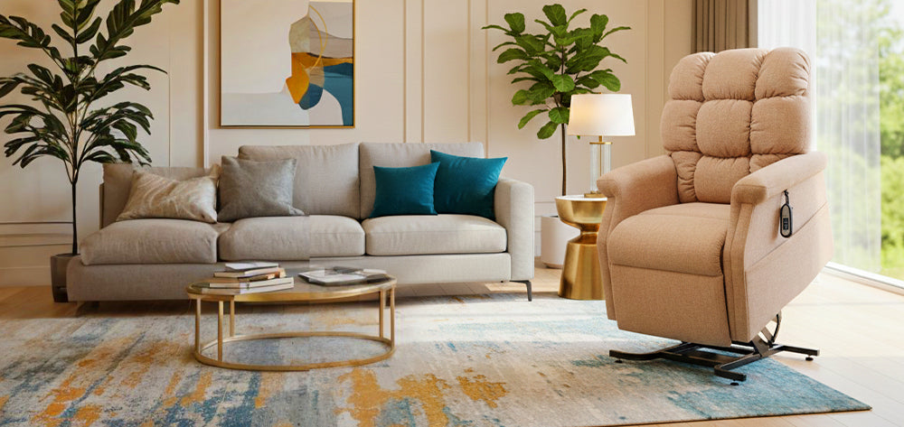 UltraComfort UC480 Aurora Medium 1 Zone 3-Position Lift Chair (400lbs) in Sandstorm fabric shown in a modern living room with blue accent pillows and bright natural lighting from Wish Rock Relaxation