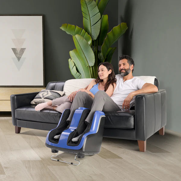 Human Touch Reflex SOL Plus Foot and Calf Massager lifestyle image showing couple relaxing with man enjoying the Reflex Sol Plus at Wish Rock Relaxation