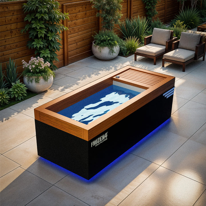 WRR Alt Text Assistant said:

Medical Breakthrough Frozen 4 Cold Plunge with wood trim and blue LED base lighting in outdoor patio from Wish Rock Relaxation.