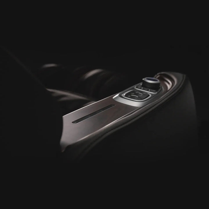 Osaki Manhattan Duo Mech 4D Massage Chair in brown showing close-up of armrest with dial and embedded controls.