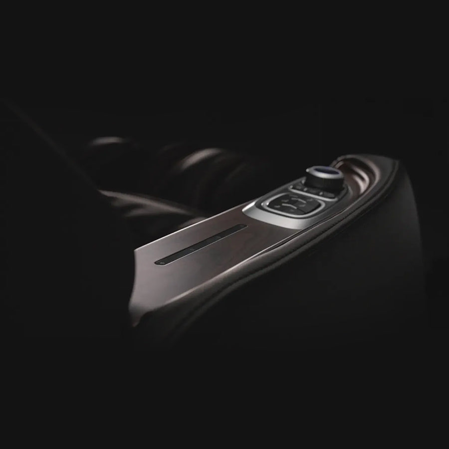 Osaki Manhattan Duo Mech 4D Massage Chair in brown showing close-up of armrest with dial and embedded controls.